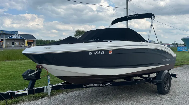 Slide: The Image of 2017 Chaparral 19 H20 Sport boat on trailer, parked outdoors. - 3