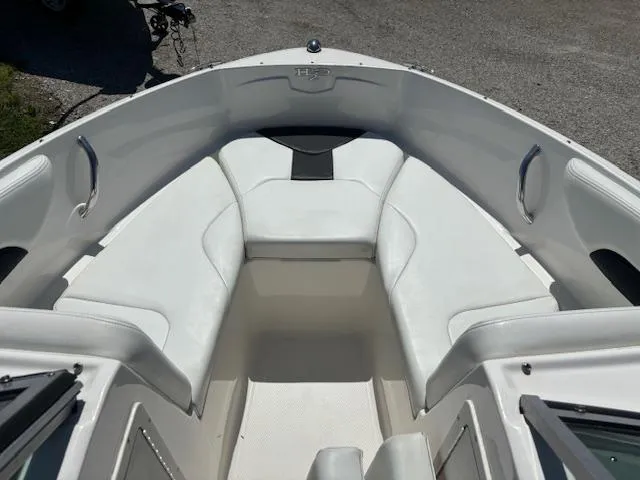 Slide: The Image of 2017 Chaparral 19 H20 Sport boat interior with white seating and open bow design. - 8