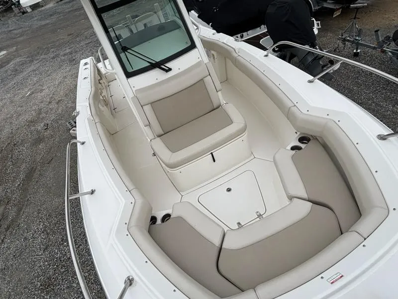 Slide: The Image of 2019 Boston Whaler 250 Outrage boat with spacious seating and sleek design. - 10
