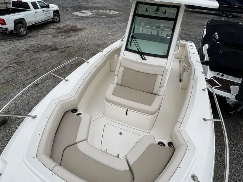 Slide: The Image of 2019 Boston Whaler 250 Outrage boat with spacious seating and sleek design. - 9