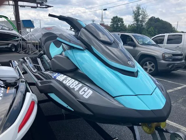 Slide: The Image of 2021 Yamaha WaveRunner VX Deluxe in vibrant blue, parked outdoors. - 10
