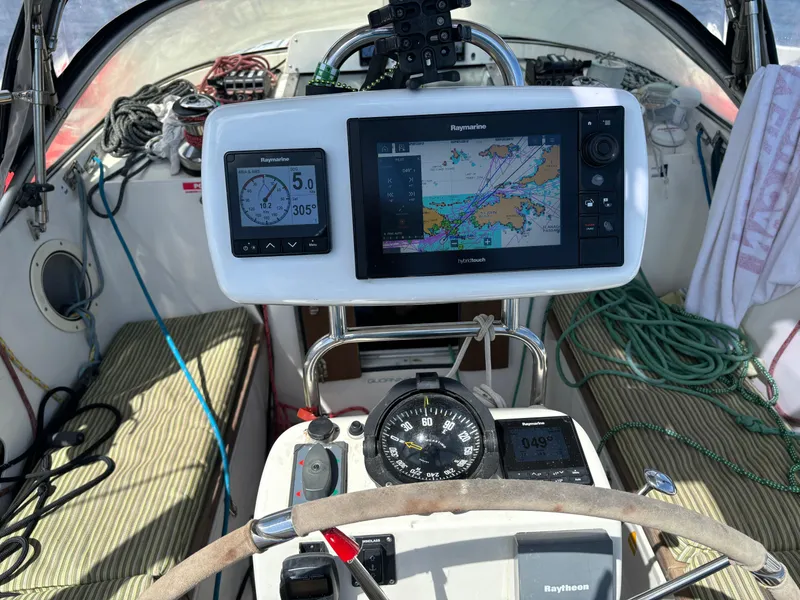 Slide: The Image of Cockpit of a 2001 Dragonfly 1200 sailboat with navigation instruments and steering wheel. - 12