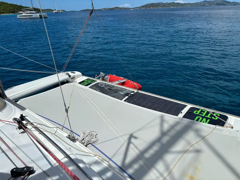 Slide: The Image of Sailing catamaran Dragonfly 1200, 2001 model, on calm blue waters with visible rigging. - 14