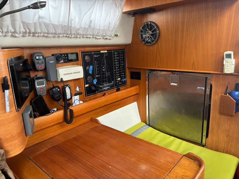 Slide: The Image of Interior of a 2001 Dragonfly 1200 sailboat with navigation equipment and wooden furnishings. - 15