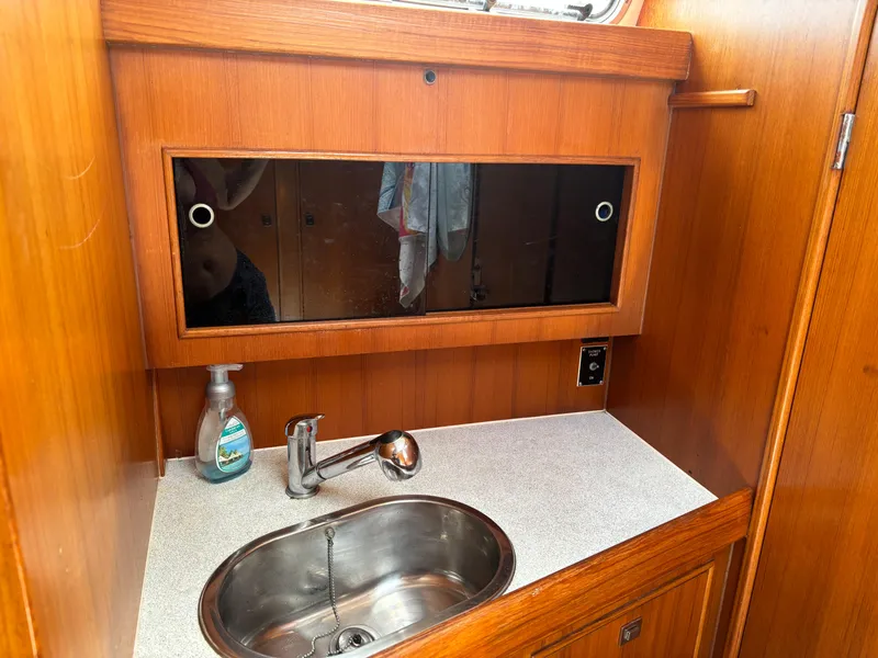 Slide: The Image of Wooden boat interior with sink and mirror, Dragonfly 1200, 2001 model. - 23