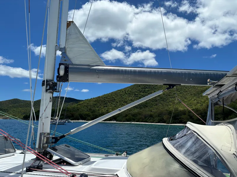 Slide: The Image of Sailboat on water with lush green hills and blue sky, Dragonfly 1200, 2001 model. - 8