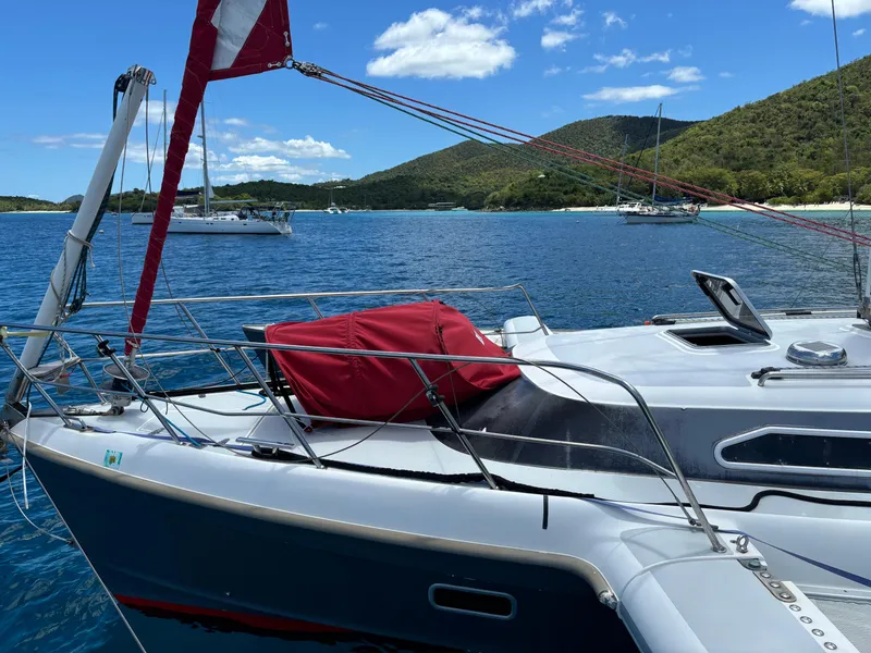 Slide: The Image of Sailboat on blue water with hills in background, Dragonfly 1200, 2001 model. - 9