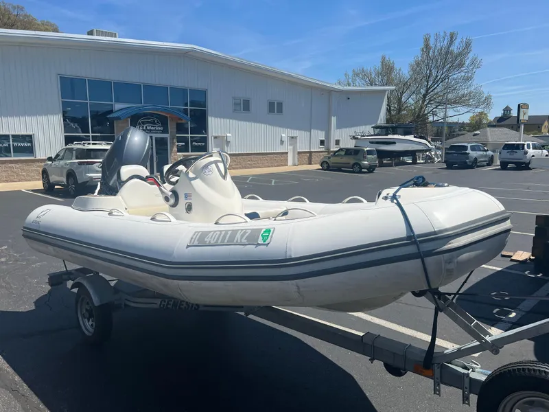 Slide: The Image of 2019 Zodiac Yachtline 400 inflatable boat on trailer in parking lot. - 0