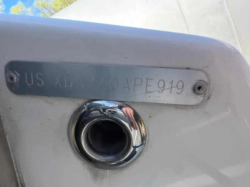 Slide: The Image of 2019 Zodiac Yachtline 400 hull identification number plate on white surface. - 7