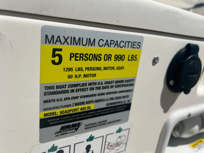 Slide: The Image of Zodiac Yachtline 400, 2019 model, capacity label: 5 persons or 990 lbs, 50 HP motor. - 9