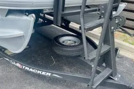 Slide: The Image of 2023 Sun Tracker Bass Buggy 16 XL trailer with spare tire and ladder. - 7