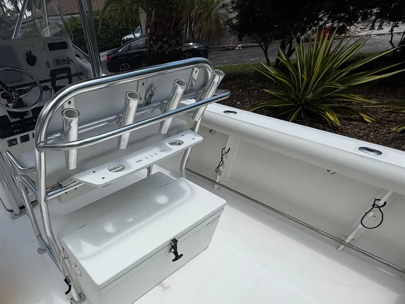 Slide: The Image of 2006 Edgewater 265CC boat interior with rod holders and storage compartment. - 11