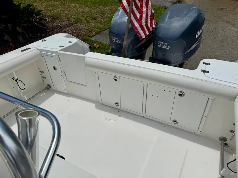 Slide: The Image of 2006 Edgewater 265CC boat deck with Yamaha 250 engines and American flag. - 13