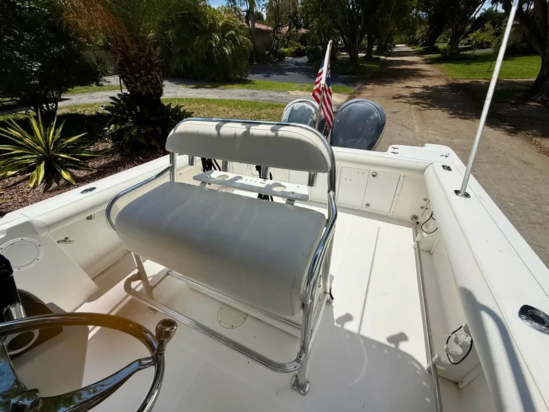 Slide: The Image of 2006 Edgewater 265CC boat interior with seating and American flag. - 9