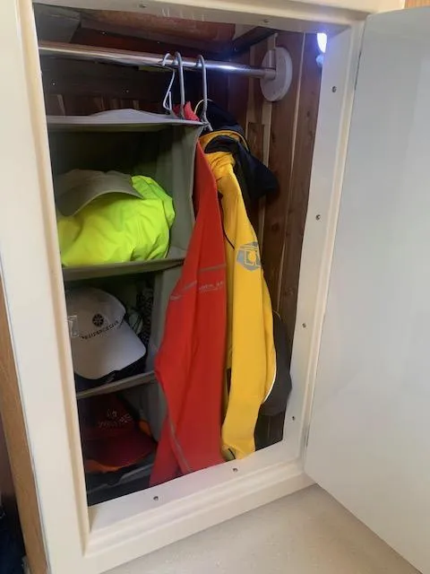 Slide: The Image of Small closet with colorful jackets and hats, Stolper 38, 2004 model. - 14