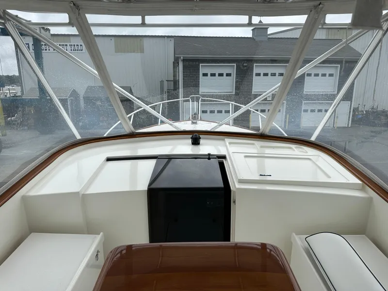 Slide: The Image of Stolper 38 boat interior, 2004 model, featuring helm station and marina view. - 16