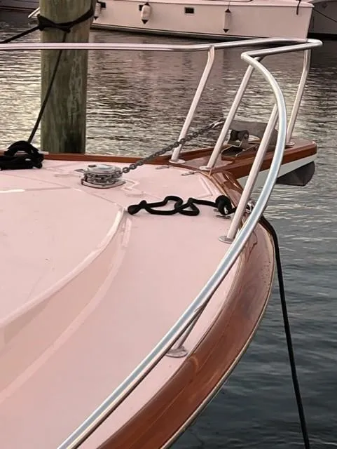 Slide: The Image of 2004 Stolper 38 boat bow with railing and mooring lines at dock. - 26