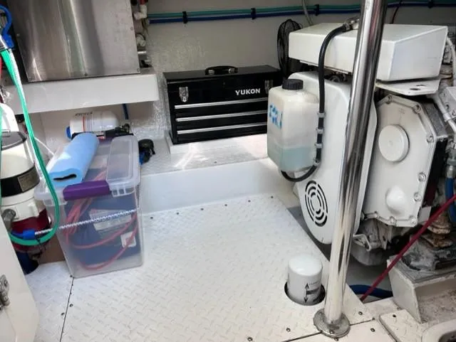 Slide: The Image of Engine room of a 2004 Stolper 38 boat with tools and equipment. - 27