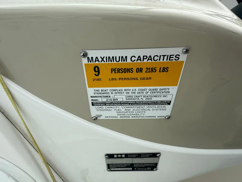 Slide: The Image of 1999 Chris-Craft 210 Bowrider capacity label, maximum 9 persons or 2185 lbs. - 28