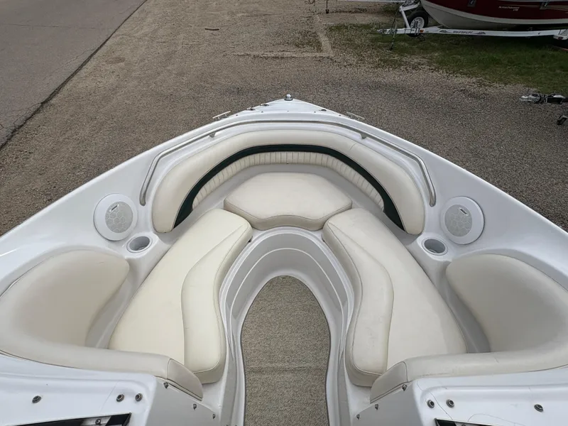 Slide: The Image of 1999 Chris-Craft 210 Bowrider with spacious white seating and cup holders. - 9