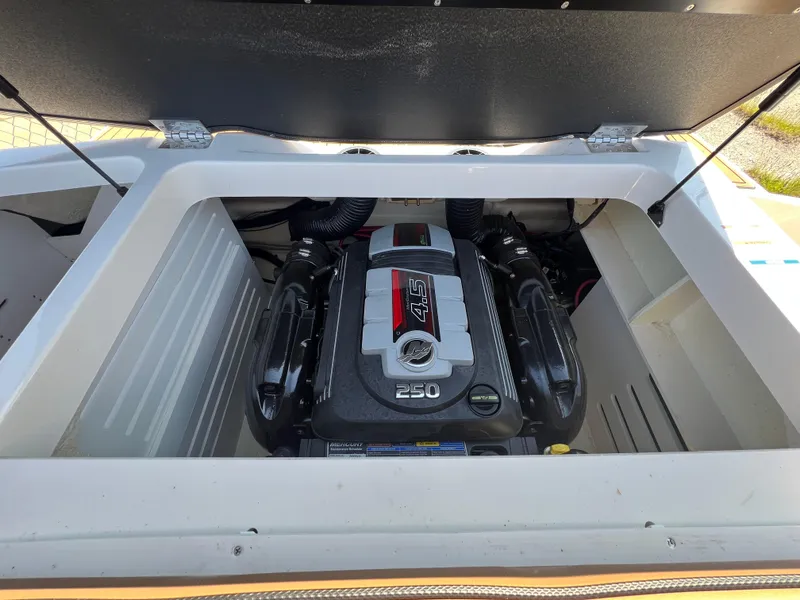 Slide: The Image of 2017 Sea Ray SPX 210 boat engine compartment with 4.5L 250 horsepower engine. - 11