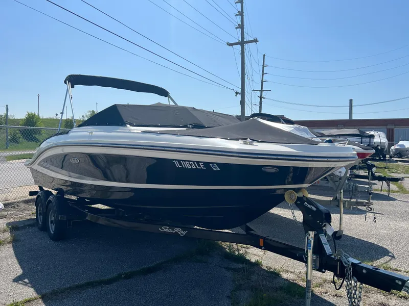 Slide: The Image of 2017 Sea Ray SPX 210 boat on trailer, parked outdoors. - 2