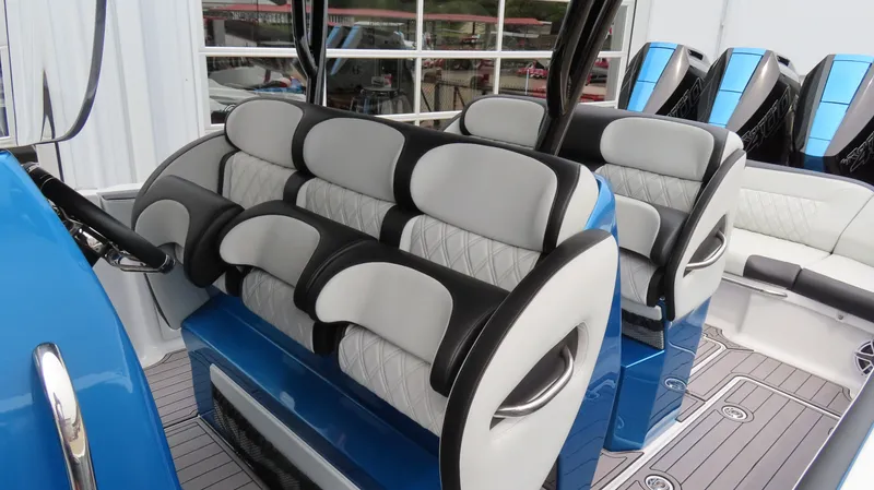 Slide: The Image of 2023 Nor-Tech 390 Sport Center Console interior with luxurious seating and modern design. - 15