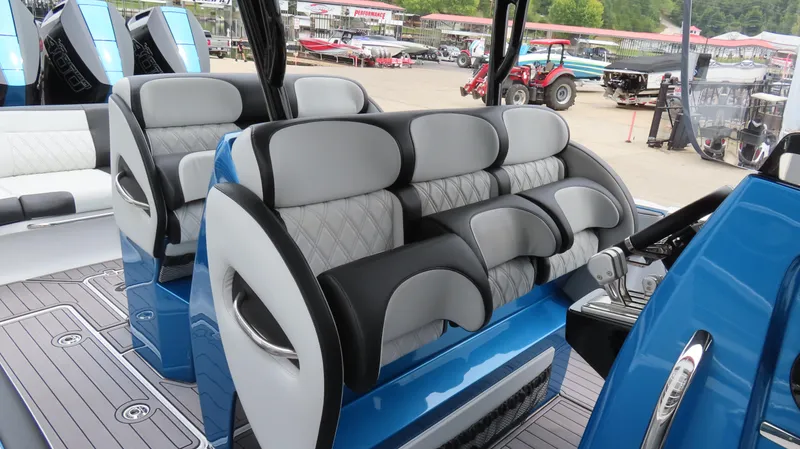 Slide: The Image of 2023 Nor-Tech 390 Sport Center Console interior with luxurious seating and modern design. - 16