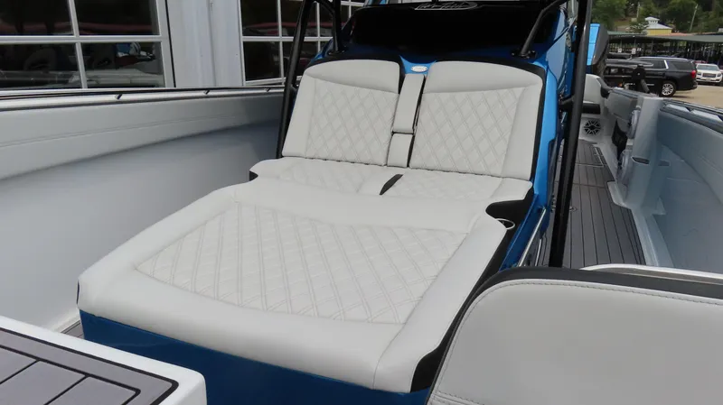 Slide: The Image of 2023 Nor-Tech 390 Sport Center Console with luxurious white seating and sleek design. - 17