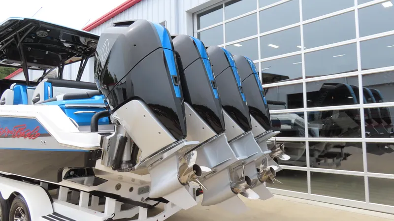 Slide: The Image of 2023 Nor-Tech 390 Sport Center Console with four powerful outboard engines. - 3