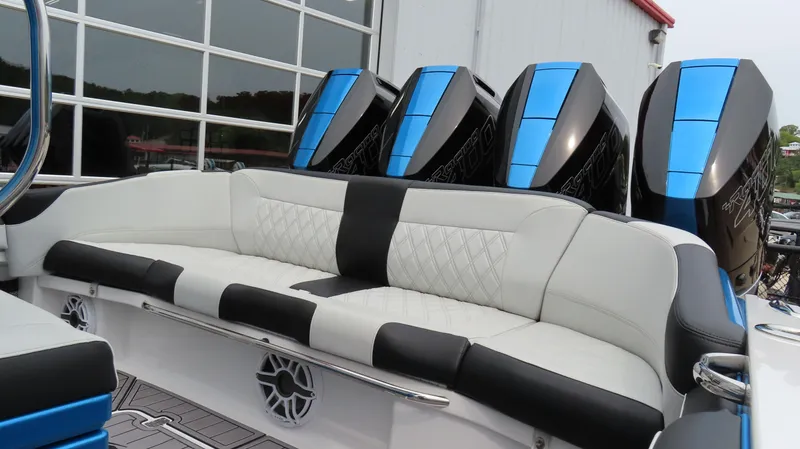 Slide: The Image of 2023 Nor-Tech 390 Sport Center Console with luxurious seating and powerful engines. - 4