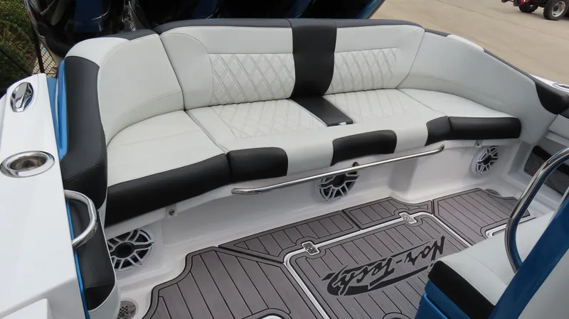 Slide: The Image of 2023 Nor-Tech 390 Sport Center Console, luxurious seating with black and white upholstery. - 5