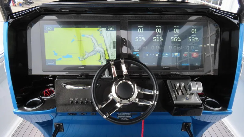 Slide: The Image of 2023 Nor-Tech 390 Sport Center Console dashboard with advanced navigation and control systems. - 9
