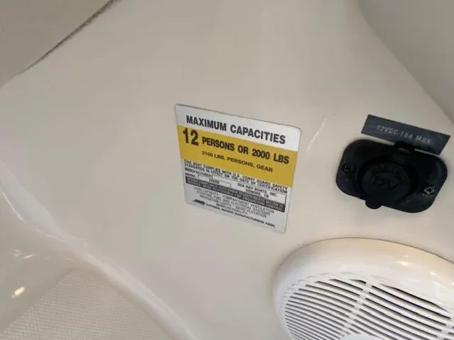 Slide: The Image of 2004 Sea Ray 240 Sundeck capacity label, 12 persons or 2000 lbs limit. - 10