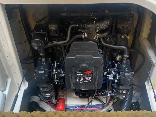 Slide: The Image of Engine compartment of a 2004 Sea Ray 240 Sundeck boat. - 18