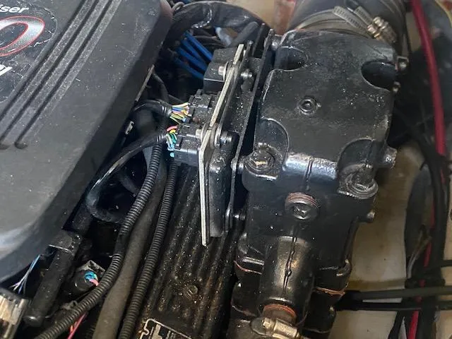 Slide: The Image of Engine components of a 2004 Sea Ray 240 Sundeck boat, featuring wiring and mechanical parts. - 22