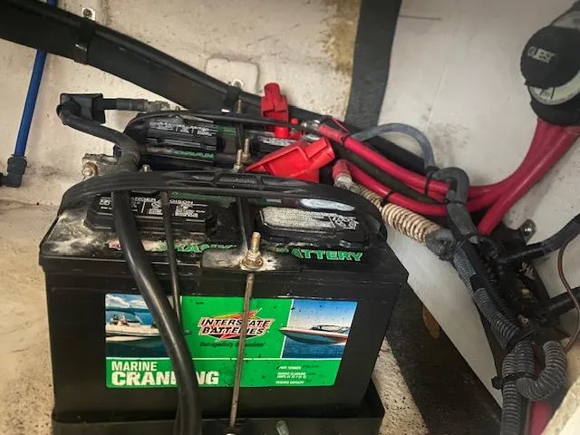 Slide: The Image of Marine cranking batteries in a 2004 Sea Ray 240 Sundeck boat engine compartment. - 24