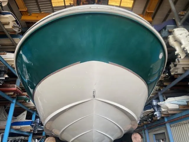 Slide: The Image of 2004 Sea Ray 240 Sundeck boat in storage, viewed from below. - 9