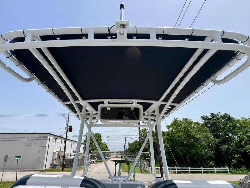Slide: The Image of 2024 Shallow Sport 25 X3 boat with T-top canopy, viewed from below. - 11