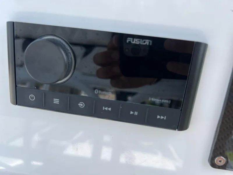 Slide: The Image of Fusion audio control panel on 2024 Shallow Sport 25 X3 boat. - 18