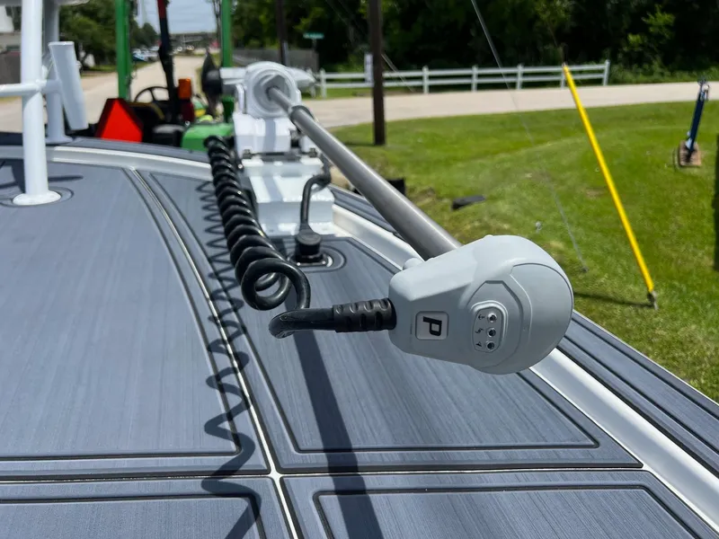 Slide: The Image of 2024 Shallow Sport 25 X3 boat deck with coiled cable and equipment. - 20