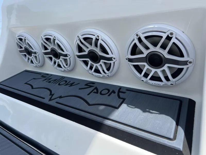 Slide: The Image of 2024 Shallow Sport 25 X3 boat speakers and logo detail. - 21