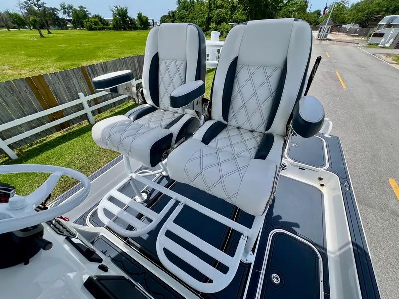 Slide: The Image of 2024 Shallow Sport 25 X3 boat seats with diamond-pattern upholstery and armrests. - 9