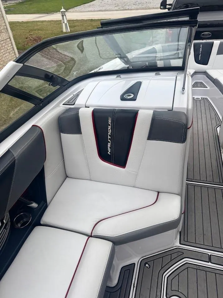 Slide: The Image of 2013 Nautique Super Air G23 boat interior with sleek seating and modern design. - 11