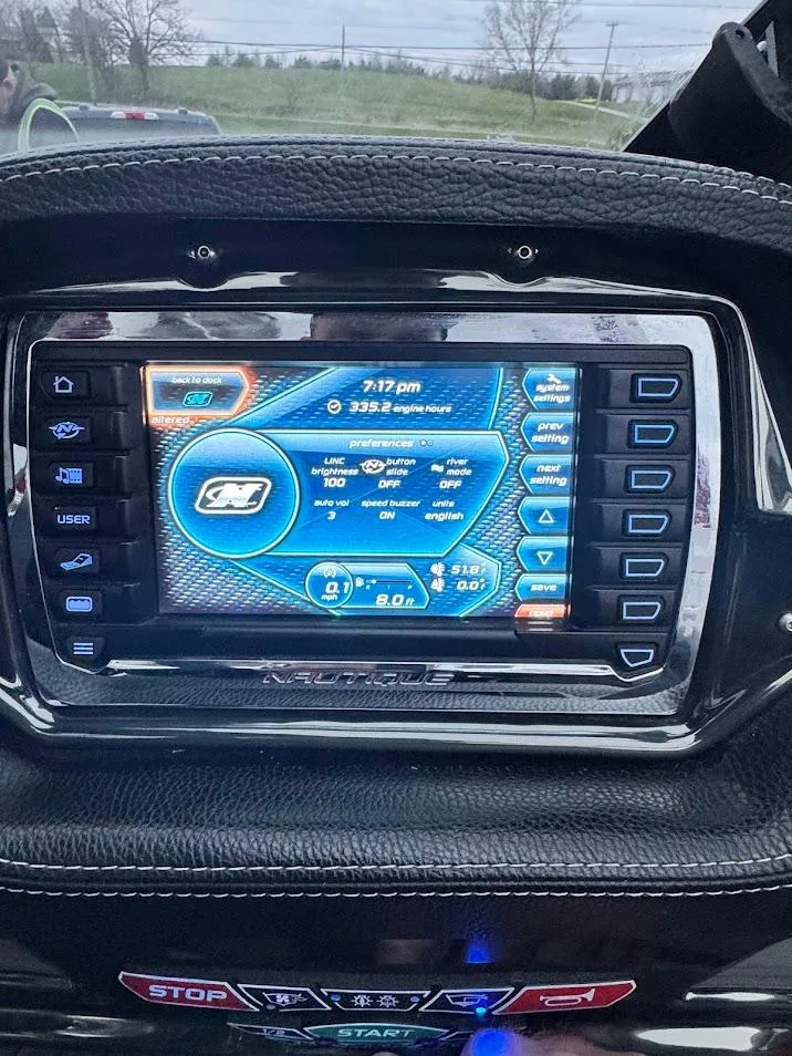 Slide: The Image of Dashboard display of a 2013 Nautique Super Air G23 boat, showing navigation and control settings. - 14