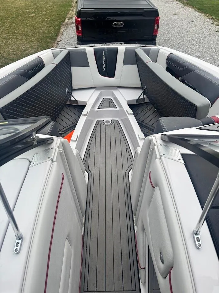 Slide: The Image of 2013 Nautique Super Air G23 boat interior with sleek seating and modern design. - 17