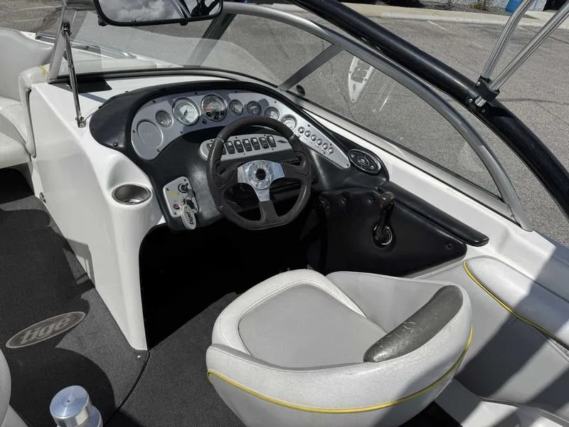 Slide: The Image of 2006 Tigé 21i boat interior with steering wheel and dashboard controls. - 10