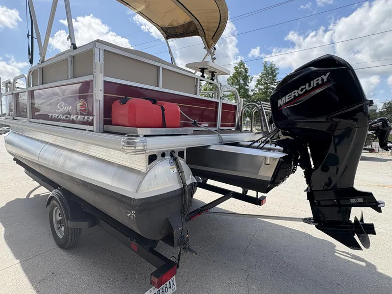 Slide: The Image of 2023 Sun Tracker Bass Buggy 16 XL pontoon boat with Mercury outboard motor. - 5