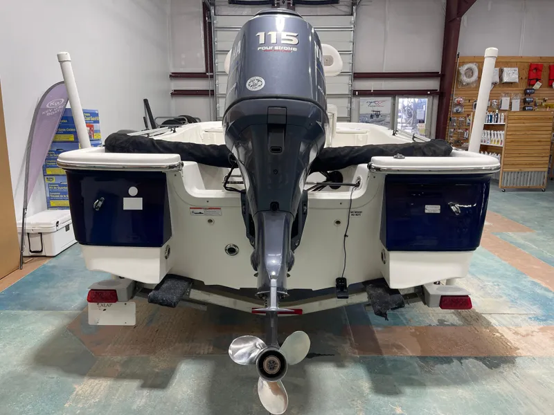 Slide: The Image of 2012 Sea Fox 180XT boat with Yamaha 115 outboard motor in a showroom. - 10