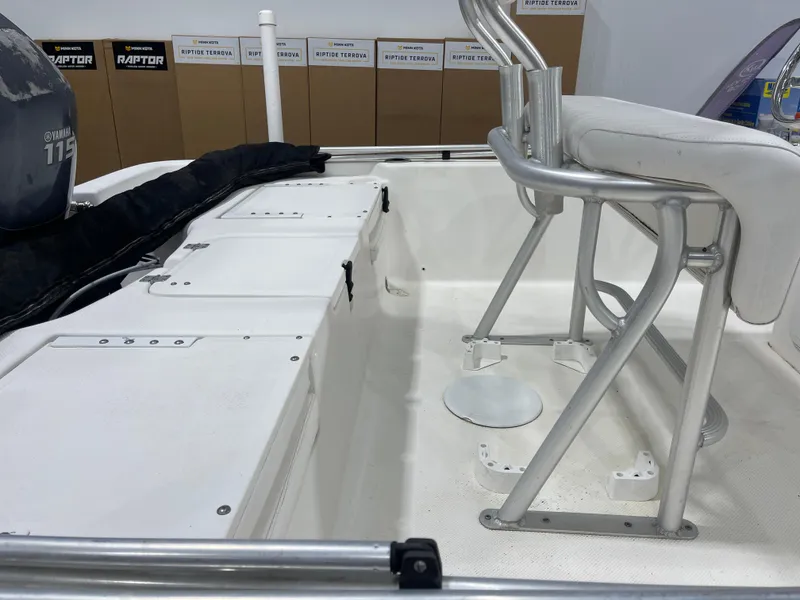 Slide: The Image of 2012 Sea Fox 180XT boat interior with Yamaha 115 engine, featuring seating and storage compartments. - 12
